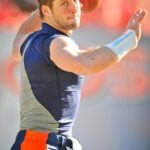 im Tebow “Tebowing” taken on 1-1-2012 at Sports Authority Field at Mile High (Denver Colorado). Denver Broncos vs Kansas City Chiefs Photo was taken prior to the start of the game.