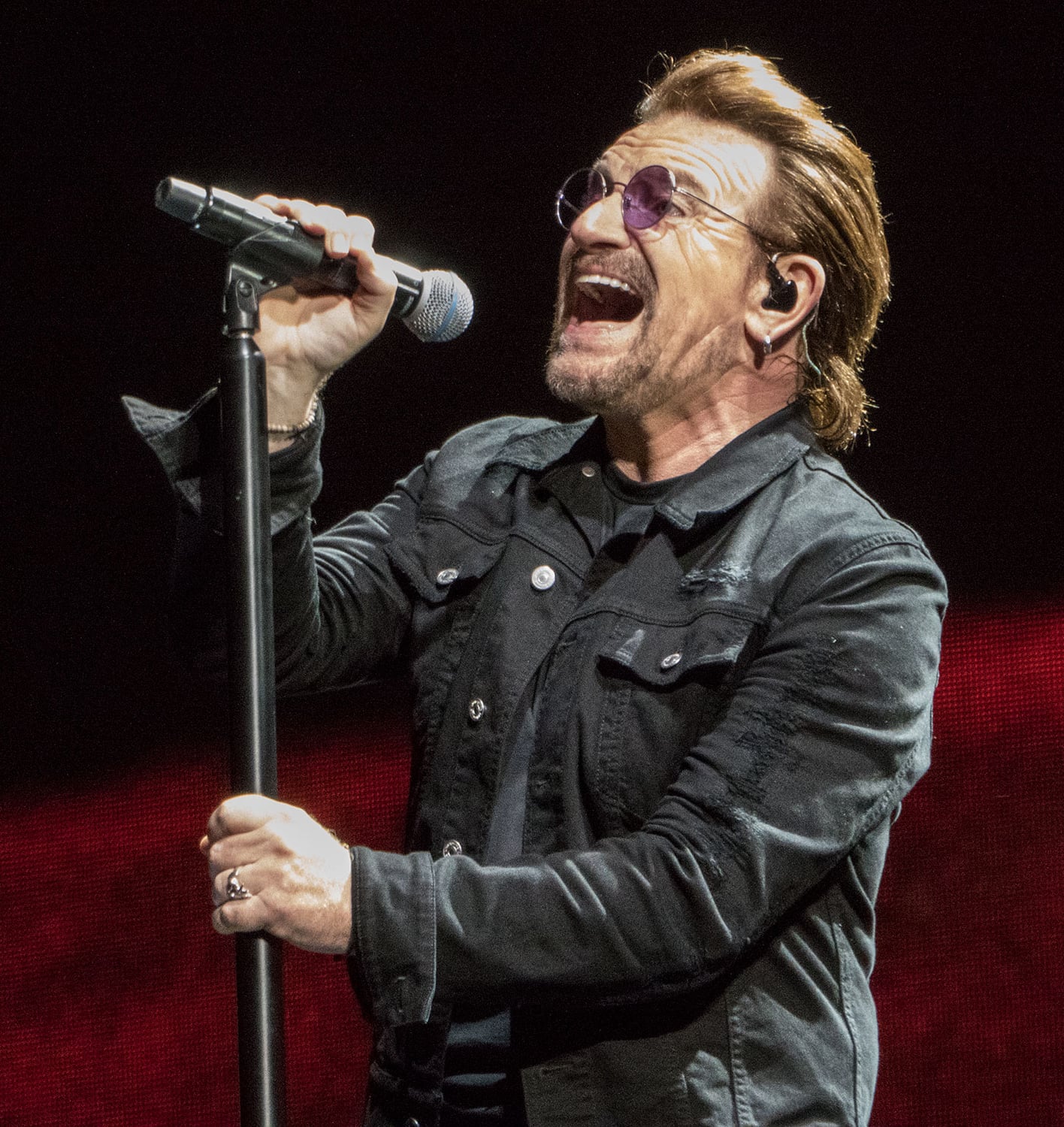 Bono singing during U2's performance at Lucas Oil Stadium in Indianapolis, Indiana on September 10, 2017