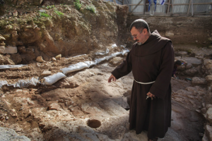 Father Jack Karam of the Basilica of the Annunciation walks thorough the remains of the dwelling in Nazareth, Israel